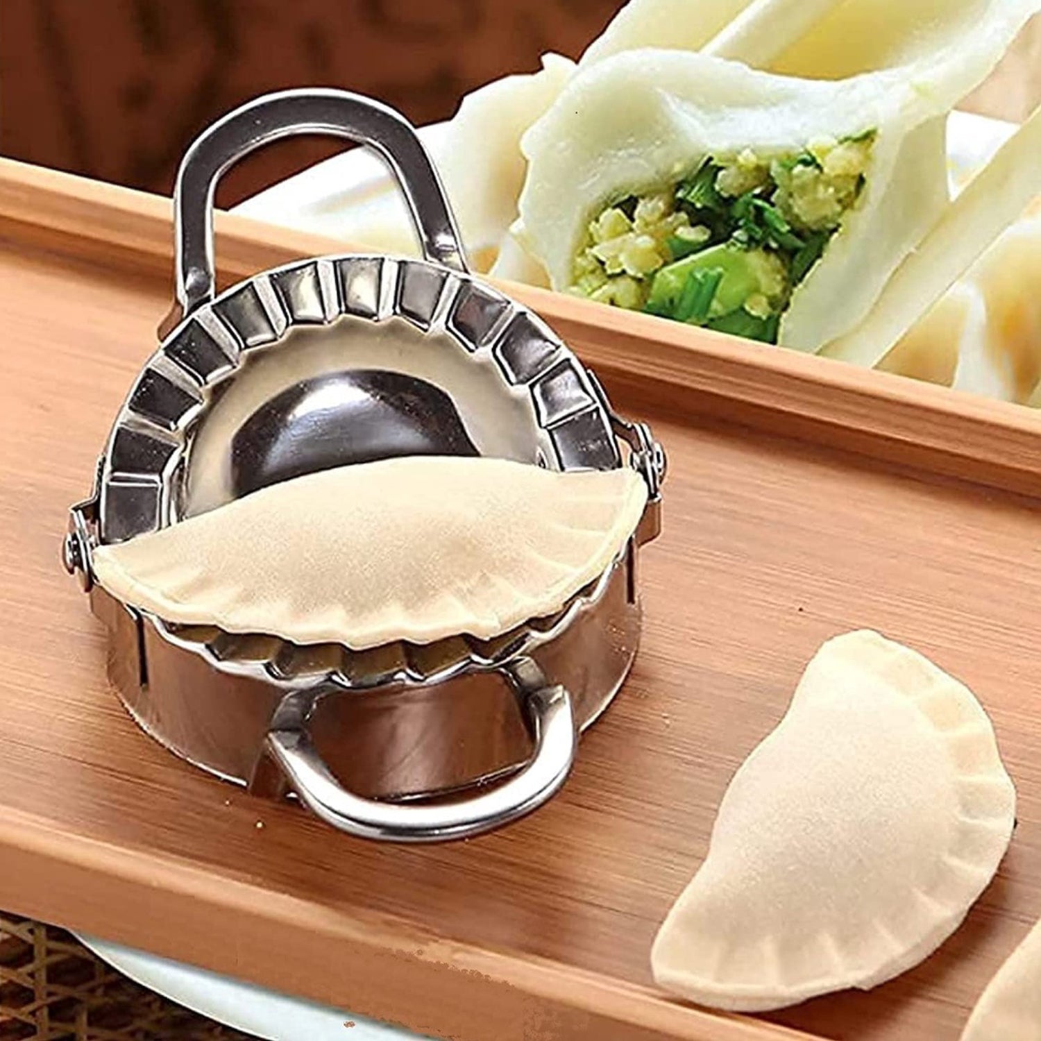 2219 Stainless Steel Dumpling Maker Dough Cutter Pie Mold Tool. 2219 Stainless Steel Dumpling Maker Dough Cutter Pie Mold Tool.